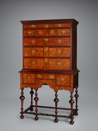 Brown high chest drawers.